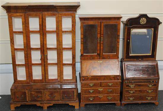 A Fergus Lane miniature 18th century style walnut bookcase,